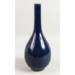 A CHINESE BLUE BOTTLE VASE with six character mark in blue. 12.5ins high.