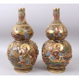 A PAIR OF JAPANESE DOUBLE GOURD SHAPED SATSUMA IMMORTAL VASES, with immortals in relief, and