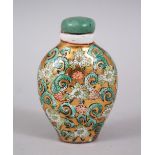 A 19TH / 20TH CENTURY CHINESE FAMILLE VERTE STYLE PORCELAIN SNUFF BOTTLE, decorated with flora