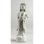 A 19TH CENTURY CHINESE BLANC-DE-CHINE FIGURE OF GUANYIN. 14ins high.