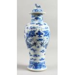 A 19TH CENTURY CHINESE BLUE AND WHITE VASE AND COVER. Four character mark. 11ins high.