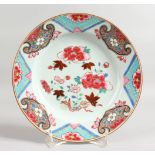 AN 18TH CENTURY CHINESE FAMILLE ROSE PLATE painted with flowers. 8.25ins diameter.