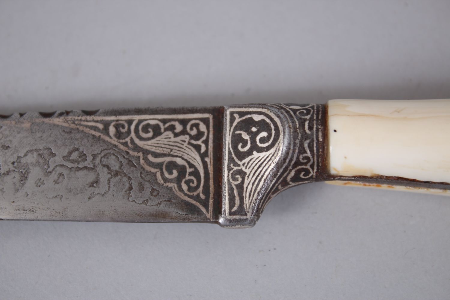 A 19TH CENTURY INDIAN DAGGER with ivory handle and silver inlaid sheath, 25cm long. - Image 2 of 4