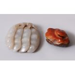 A GOOD 18TH / 19TH CENTURY CHINESE WHITE JADE PENDAND IN THE FORM OF BEANS, together with a