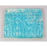 A RARE 12TH-13TH CENTURY PERSIAN SELJUK TURQUOISE GLAZED TILE with ribbed decoration, 17cm x 22cm.