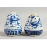A SMALL PAIR OF CHINESE BLUE AND WHITE VASES. 3.5ins high. 559.