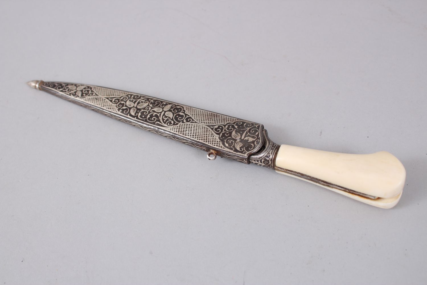 A 19TH CENTURY INDIAN DAGGER with ivory handle and silver inlaid sheath, 25cm long. - Image 4 of 4