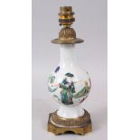 A CHINESE YONGZHENG PERIOD FAMILLE ROSE PORCELAIN VASE, circa 1730, mounted as a lamp with ormolu