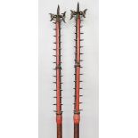 A GOOD PAIR OF ORIENTAL POLE ARMS, the tops with spikes and hooks, the collar formed from carved