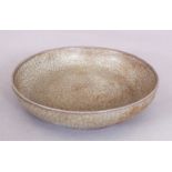 A CHINESE SONG STYLE GUAN WARE CERAMIC DISH, applied with an olive-green crackle glaze, 5.5in