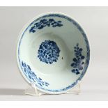 A 19TH CENTURY CHINESE BLUE AND WHITE CIRCULAR BOWL, the sides with figures and trees.