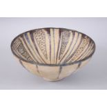 A 14TH CENTURY PERSIAN SULTANABAD GLAZED CIRCULAR POTTERY BOWL with stripe decoration, 19cm diameter