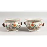 A GOOD PAIR OF SAMSON FAMILLE ROSE CIRCULAR POTS painted with flowers with kylin handles. 5.5ins