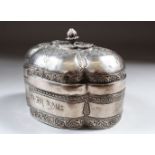 AN 18TH CENTURY MUGHAL INDIAN SILVER SHAPED BOX AND COVER, inscription on the front, 13cm long,