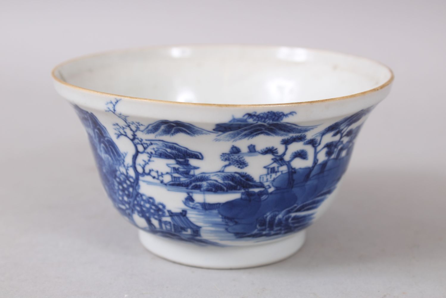 A GOOD 18TH CENTURY QIANLONG CHINESE BLUE & WHITE BOWL, decorated with landscape scenes, 6cm high