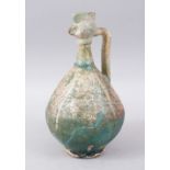 A RARE 12TH-13TH CENTURY PERSIAN TURQUOISE GLAZED EWER with cockerel spout, 28cm high.