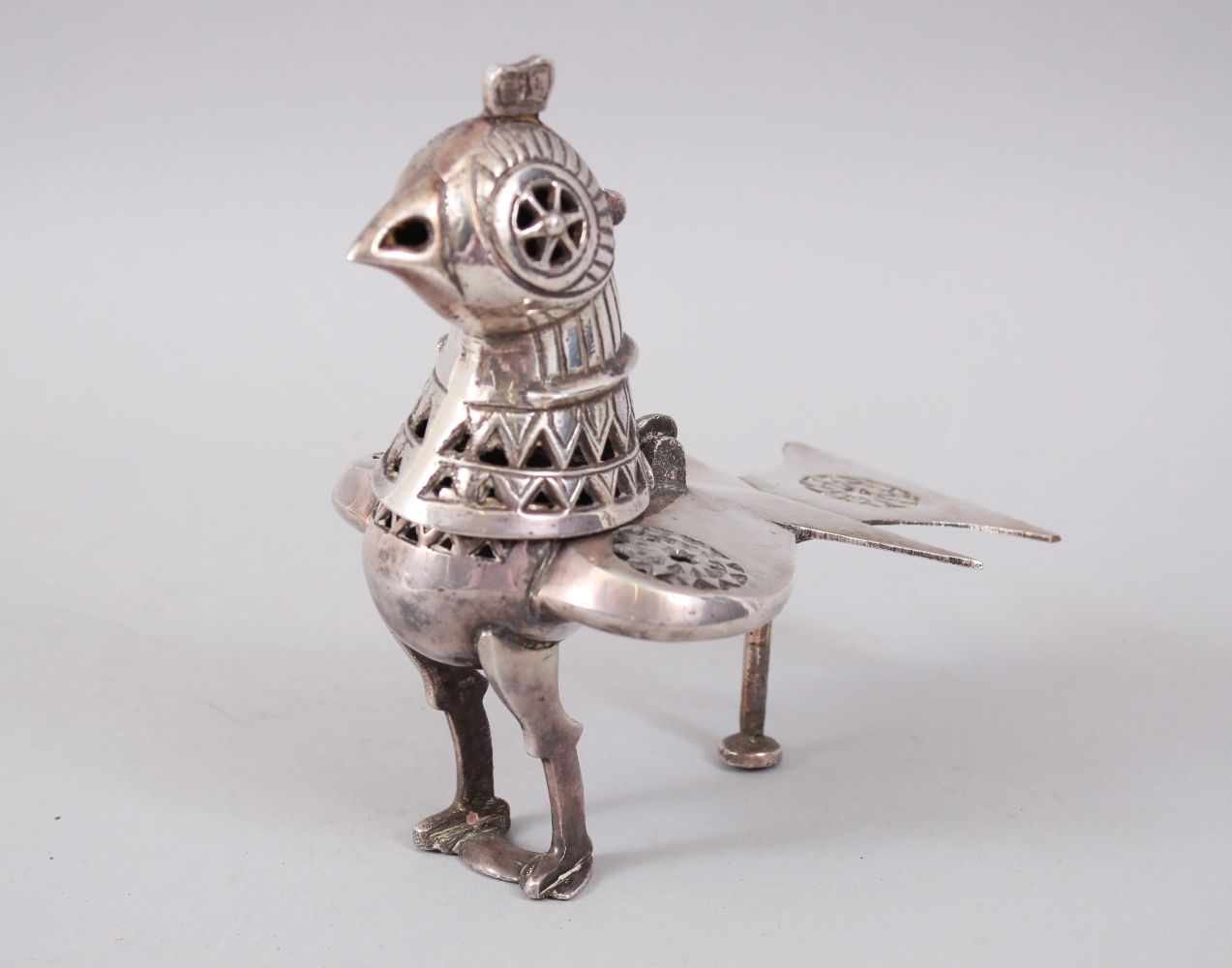 A 19TH CENTURY INDIAN SOLID SILVER BIRD SHAPED INCENSE BURNER with hinged head, 15cm high x 14cm