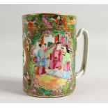 A GOOD CANTON MUG with panels of birds, flowers and figures. 5ins high.