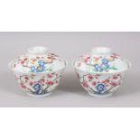 A GOOD PAOIR OF 20TH CENTURY CHINESE FAMILLE ROSE PORCELAIN TEA CUP & COVER, the decoration of