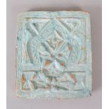 AN EARLY ISLAMIC BLUE IRIDESCENT TILE.