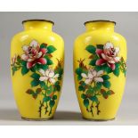 A GOOD PAIR OF YELLOW GROUND CLOISONNE ENAMEL VASES decorated with flowers.7.5ins high.