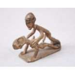 A SMALL SHANTI BRONZE / METAL EROTIC FIGURE, 4.5cm high x 5cm wide.