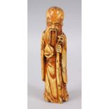 A GOOD CHINESE CARVED BONE OR TOOTH FIGURE OF SHOU LOU, depicted holding his staff and gourd, 16cm