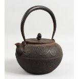 A JAPANESE IRON GLOBULAR KETTLE.