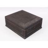 A 19TH CENTURY NORTH INDIAN CARVED EBONY JEWELLERY BOX with hinged lid and fitted interior, 30cm