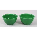 A GOOD PAIR OF CHINESE GREEN PEKING GLASS / GLASS BOWLS, 11.5cm diameter (2).