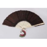 A 19TH CENTURY CHINESE CANTON CARVED IVORY & PEACOCK FEATHER FAN, the stems with carved details of