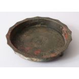A 12TH - 13TH CENTURY PERSIAN SELJUK BRONZE FOOTED DISH.