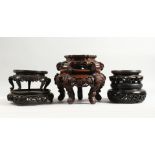 A BOX OF SIX LARGE CHINESE CARVED WOOD VASE STANDS.