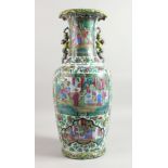 A LARGE CHINESE FAMILLE ROSE VASE with panels of figures and kylin handles.