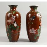 A LARGE PAIR OF 19TH CENTURY JAPANESE CLOISONNE ENAMEL VASES, red ground with chrysanthemums and