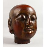 A CARVED WOOD AND GILDED BUST OF LOHAN. 8ins high.