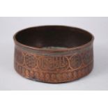 A RARE 15TH CENTURY MAMLUK ENGRAVED COPPER CIRCULAR BOWL, the sides with calligraphy, 14cm