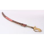 A FINE INDIAN SWORD with gilded handled and gold inlaid worked steel scabbard.