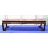 A GOOD LARGE 19TH CENTURY CHINESE HARDWOOD KANG TABLE, the feet formed in scrolling geometric style,