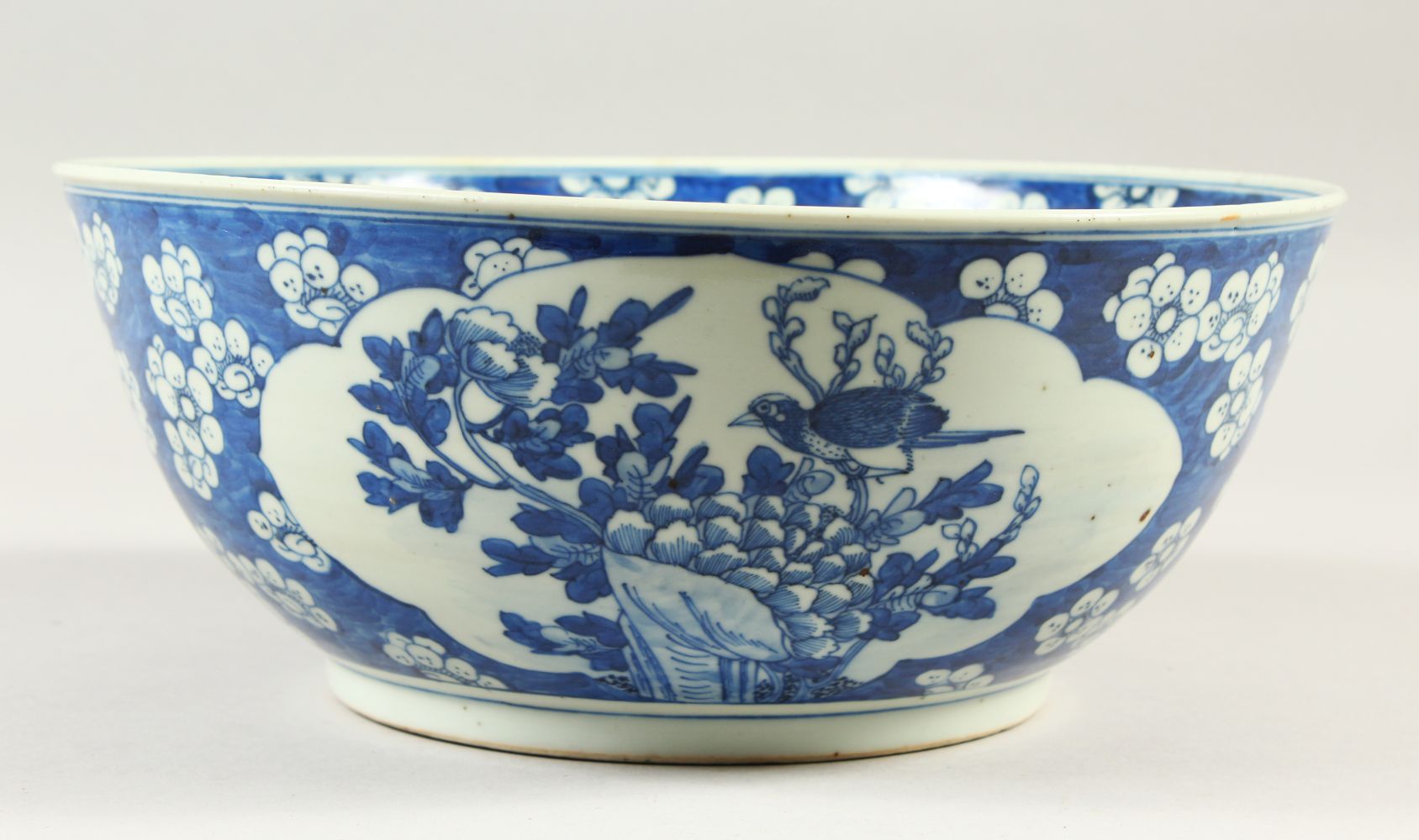 A LARGE 19TH CENTURY CHINESE BLUE & WHITE PRUNUS BOWL, 27.5cm diameter x 11.4cm high.