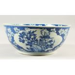 A LARGE 19TH CENTURY CHINESE BLUE & WHITE PRUNUS BOWL, 27.5cm diameter x 11.4cm high.
