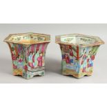 A VERY GOOD PAIR OF CANTON HEXAGONAL JARDINIERES, each panel painted with figures. 5.5ins high.