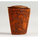 A GOOD CHINESE CARVED WOOD SNUFF BOX, the front carved with figures. 3.5ins long.