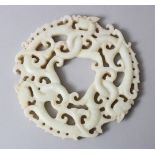 A GOOD CHINESE 19TH / 20TH CENTURY CARVED WHITE JADE ROUNDEL / BI DISK, carved to depict intertwined