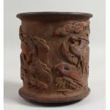 A CARVED WOOD BAMBOO BRUSH POT. 6.5ins high.