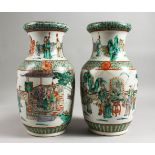 A VERY GOOD PAIR OF 19TH CENTURY CHINESE FAMILLE VERTE VASES with two continuous scenes with