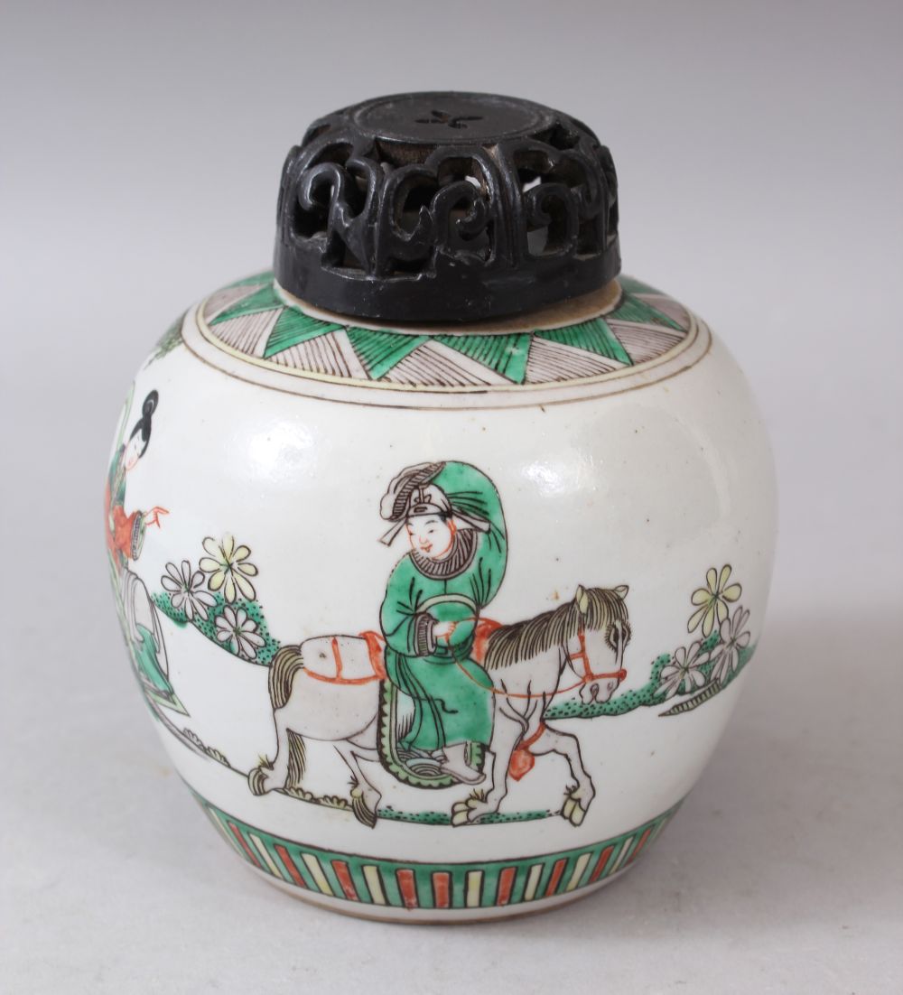 A SMALL 20TH CENTURY CHINESE FAMILLE VERTE GINGER JAR with wooden cover, 14cm high.