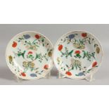 A PAIR OF CHINESE FAMILLE VERTE SAUCERS. 5.5ins diameter.