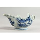 A CHINESE BLUE AND WHITE SAUCEBOAT. 9.5ins long.