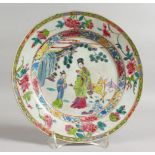 AN 18TH CENTURY CHINESE FAMILLE ROSE PLATE with figures and a deer. 9ins diameter.